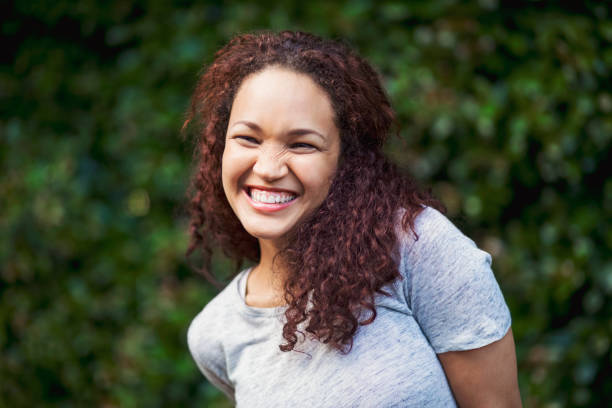 istock Cheerful beautiful young woman looking away 1058661962