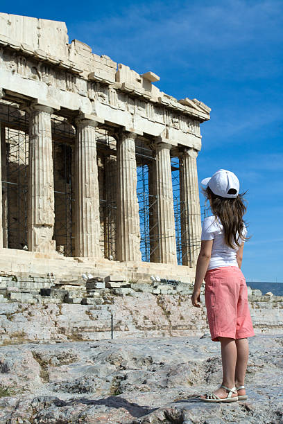 istock Child in front of Ancient Parthenon Acropolis Athens Greece 105866508