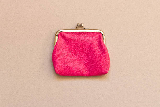istock Pink wallet on grey background . Close up. Top view 1058675198