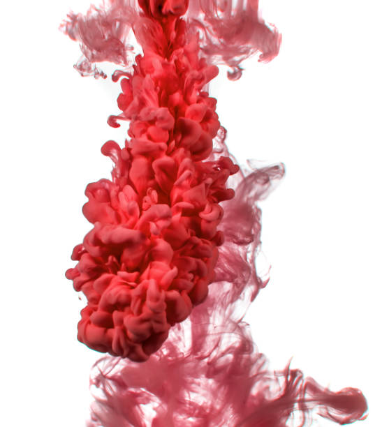 istock red ink in water isolated on white background 1058676444