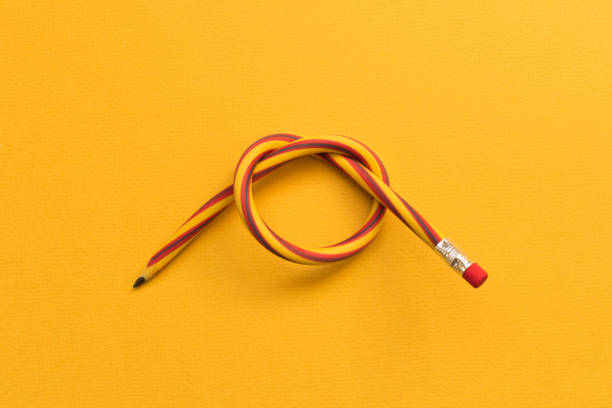 istock Flexible pencil . Isolated on yellow background 1058679994