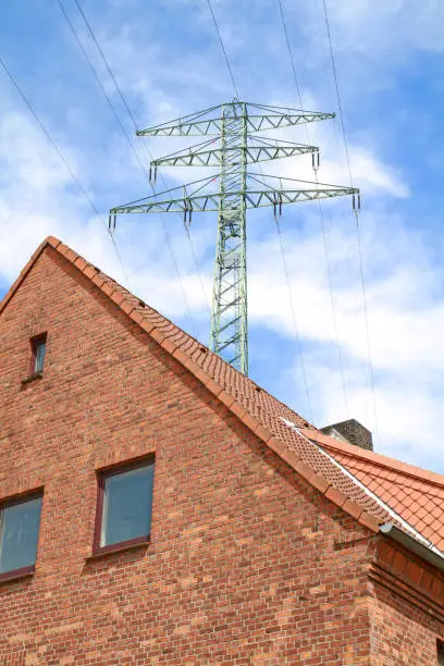 electricity pylon over dwelling