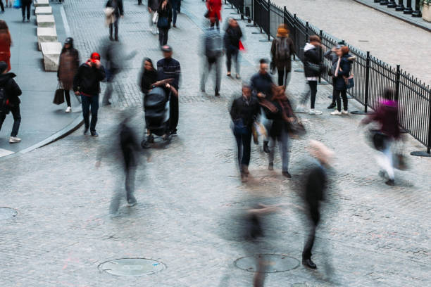 istock Business People Walking Blurred Motion 1058681396