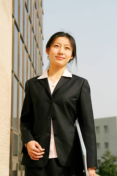 istock businesswomen holding foler 105868377