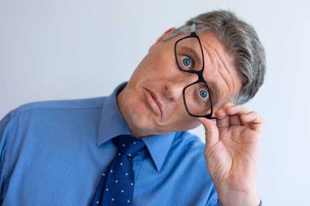 istock Crazy businessman fooling at camera 1058684030