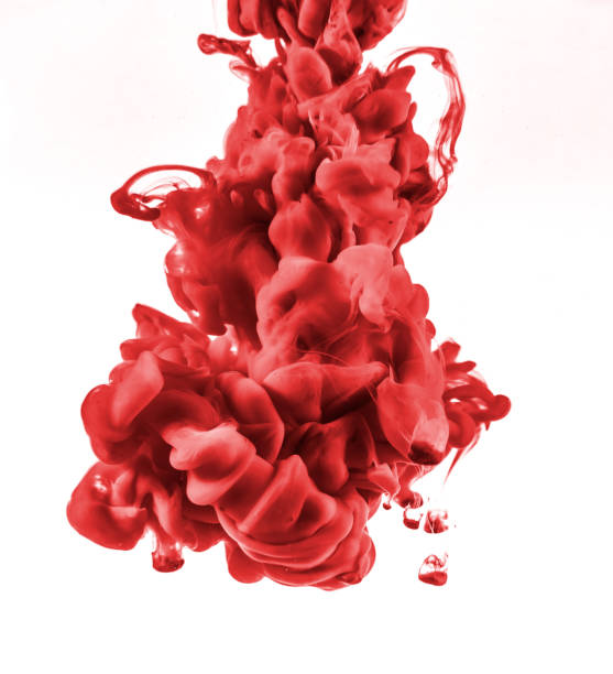 istock red ink in water isolated on white background 1058685254