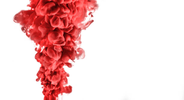 istock red ink in water isolated on white background 1058685350
