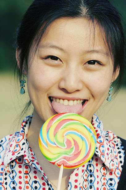 istock young asian girl with Lollipop 105868582