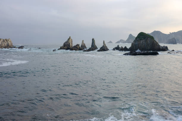 istock Rocky coast at sunset, Gueirua beach, Asturias, Spain 1058687512
