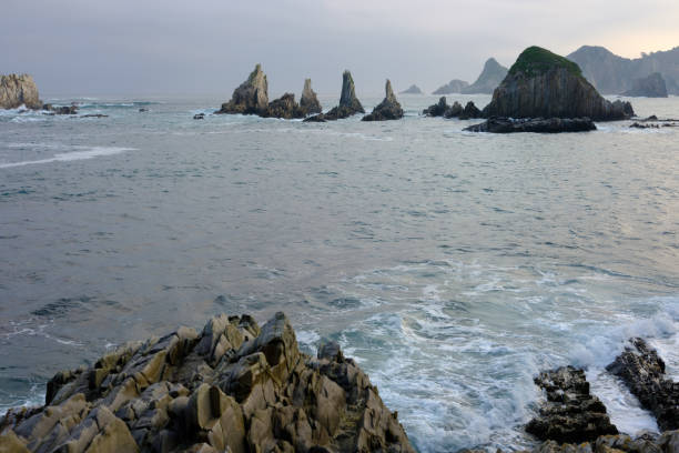 istock Rocky coast at sunset, Gueirua beach, Asturias, Spain 1058687552