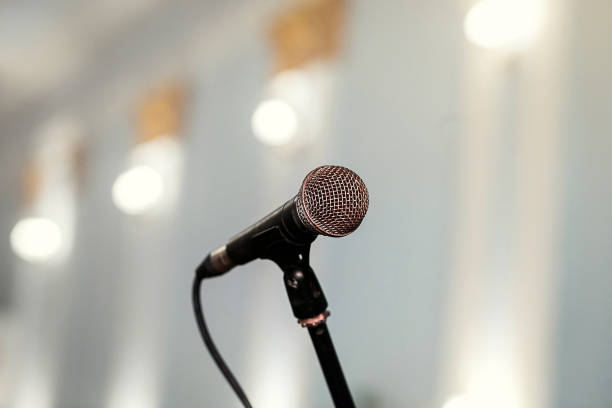 istock A microphone on stage in a concert hall or american bar (restaurant) during a show. 1058687748