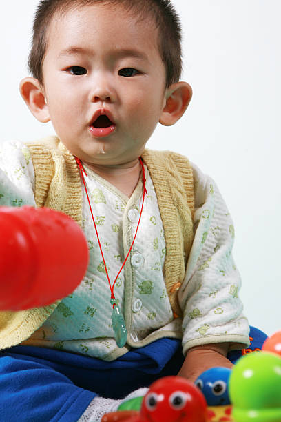 istock chinese baby playing with toy 105869182