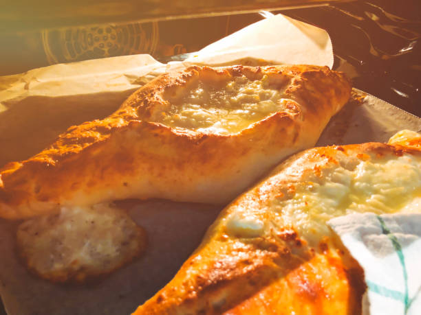 istock Ajarian khachapuri Georgian cheese pie with egg close-up. 1058694638