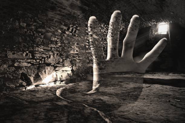 Creepy hand in the dark cell Double exposure killing photos stock pictures, royalty-free photos & images