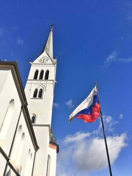 istock Slovenian flag next to Church 1058696790