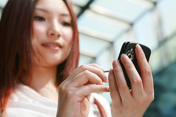 istock young business woman working with mobile phone 105869711