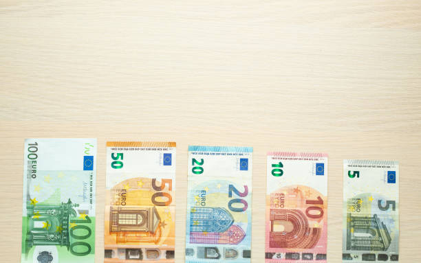 istock Euro bank notes on the table 1058699658