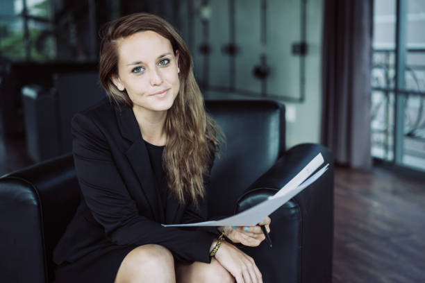 istock Content Business Lady with Document in Lounge 1058699698