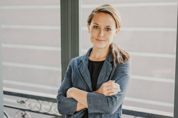 istock Content Business Woman Standing at Window 1058699764