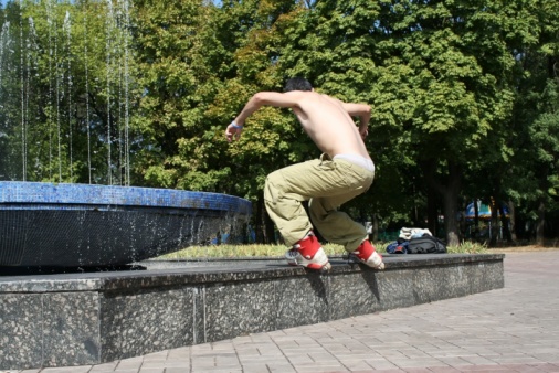 Skater doing a royale trick on a ledge