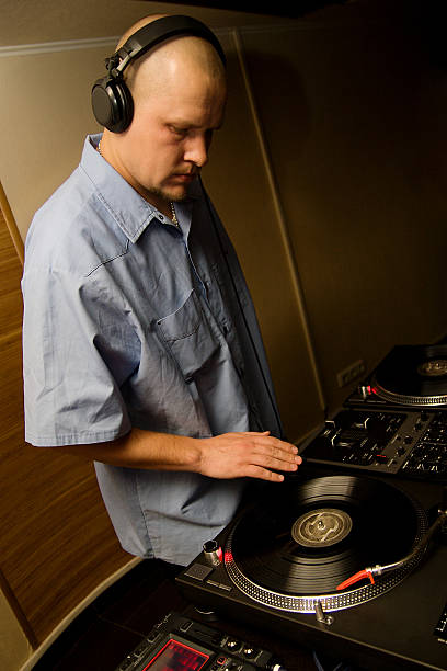 istock Hip-hop deejay playing vinyl record 105870510