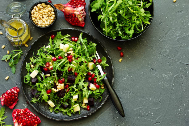 istock Fresh salad of arugula, beet and cheese. 1058706714