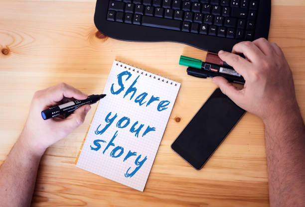istock share Your Story word on notebook on wooden table 1058707526