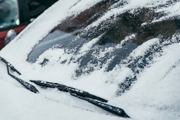 istock car covered with snow on outdoors parking in winter day 1058709282