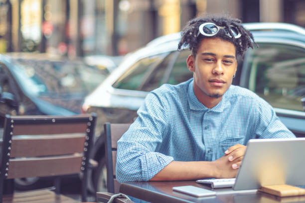 istock Young influencer is blogging from a sidewalk caffee 1058709314