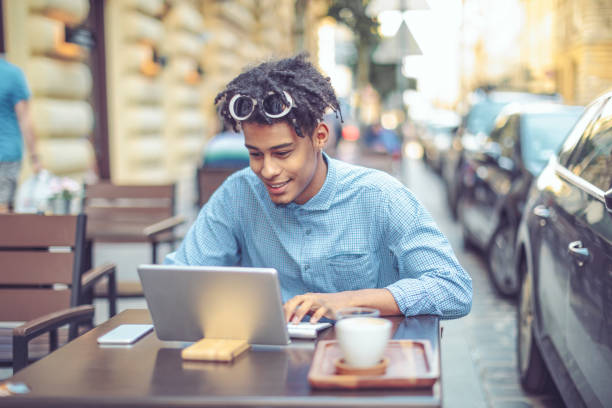 istock Young influencer is blogging from a sidewalk caffee 1058709438