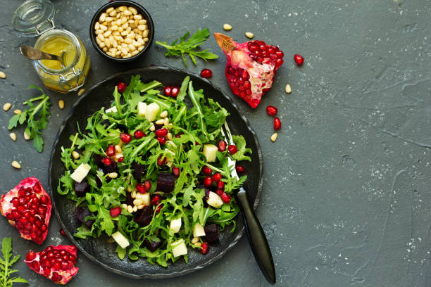 istock Fresh salad of arugula, beet and cheese. 1058709904