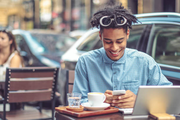istock Young influencer is blogging from a sidewalk caffee 1058710108