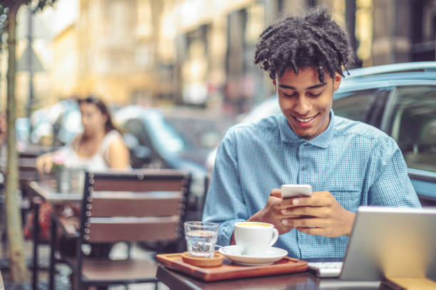 istock Young influencer is blogging from a sidewalk caffee 1058710862