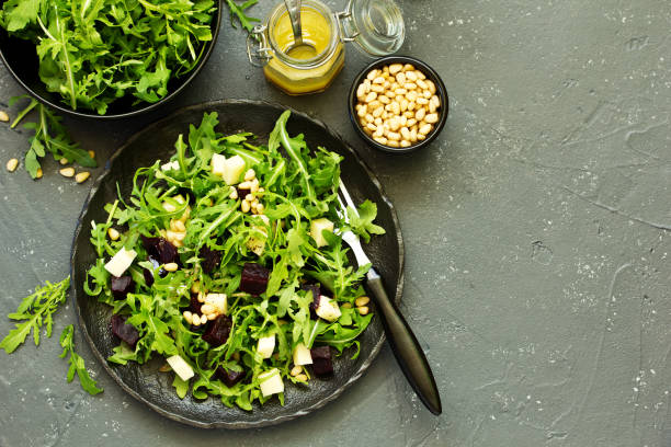 istock Fresh salad of arugula, beet and cheese. 1058711000