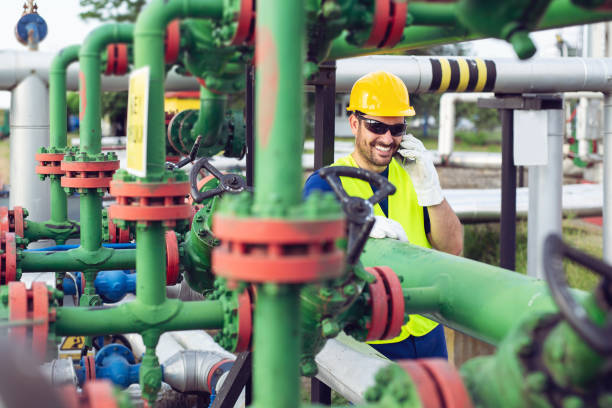 istock Industrial Worker With Cell Phone 1058712540