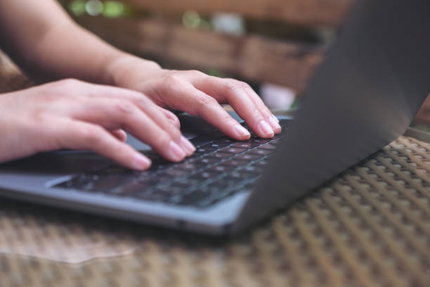 istock Closeup image of hand using and typing on laptop keyboard 1058712608