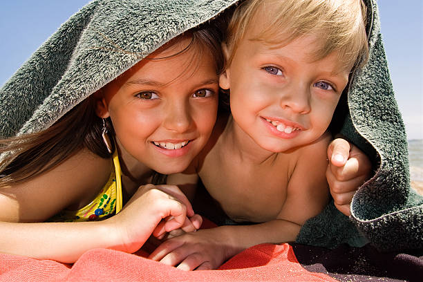 istock Little brother and sister playing hide-and-seek 105871502