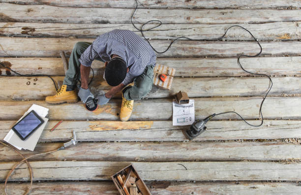 Young man renovating old floor