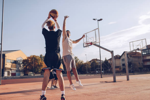 istock Group of friends playing basketball 1058719620