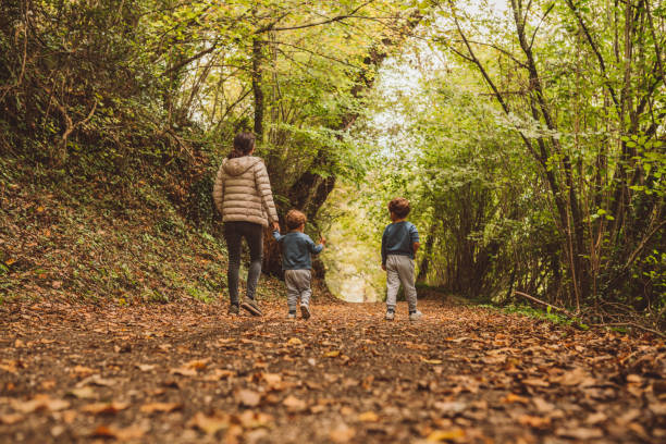 istock Brothers running in the forest 1058722426