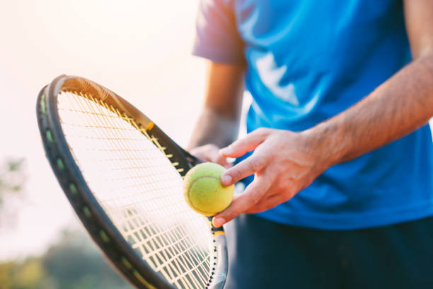 boy getting ready for a serve in tennis. - racket sport fotos imagens e fotografias de stock