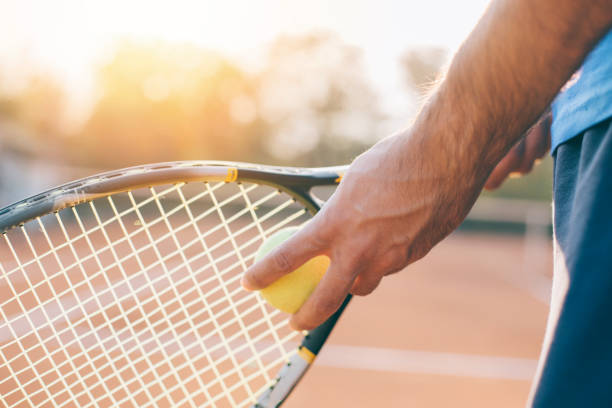 istock Boy getting ready for a serve in tennis. 1058724368