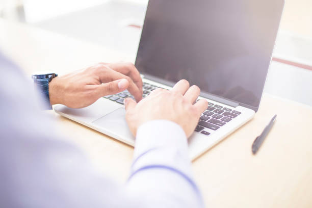 istock Businessman working on laptop in the office 1058724638
