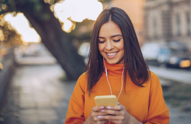 istock Beautiful woman using phone 1058727490