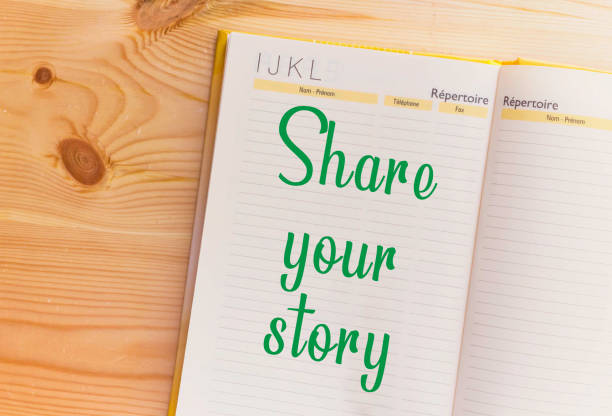istock share Your Story word on notebook on wooden table 1058729490