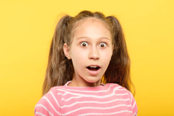 istock surprised astonished overwhelmed girl reaction 1058730478