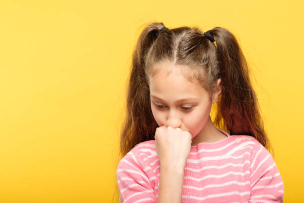 istock sad pensive thoughtful girl looking down emotion 1058730688
