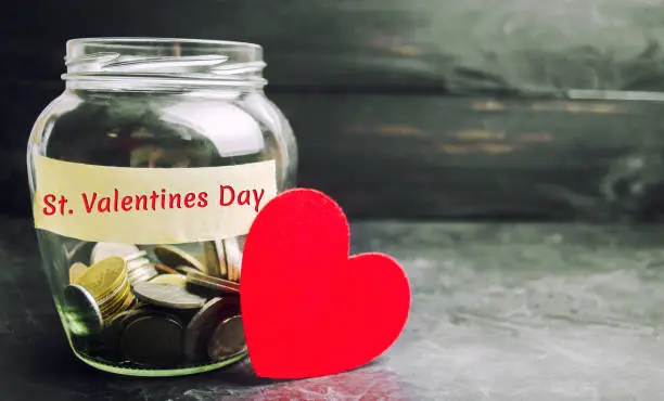 Photo of Glass jar with money and the inscription 