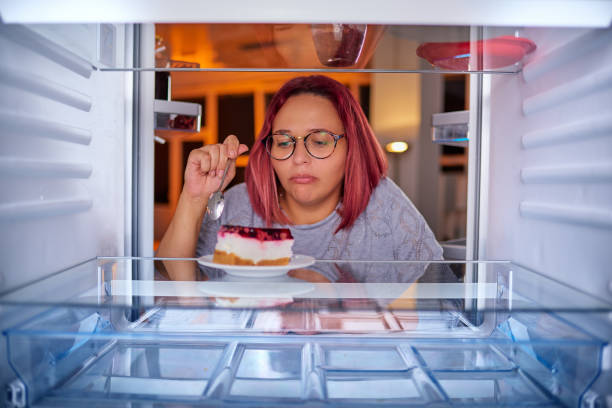 istock Woman eating gateau. 1058733918