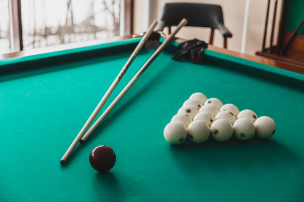 istock Russian billiard table with balls and cue sticks. 1058734050